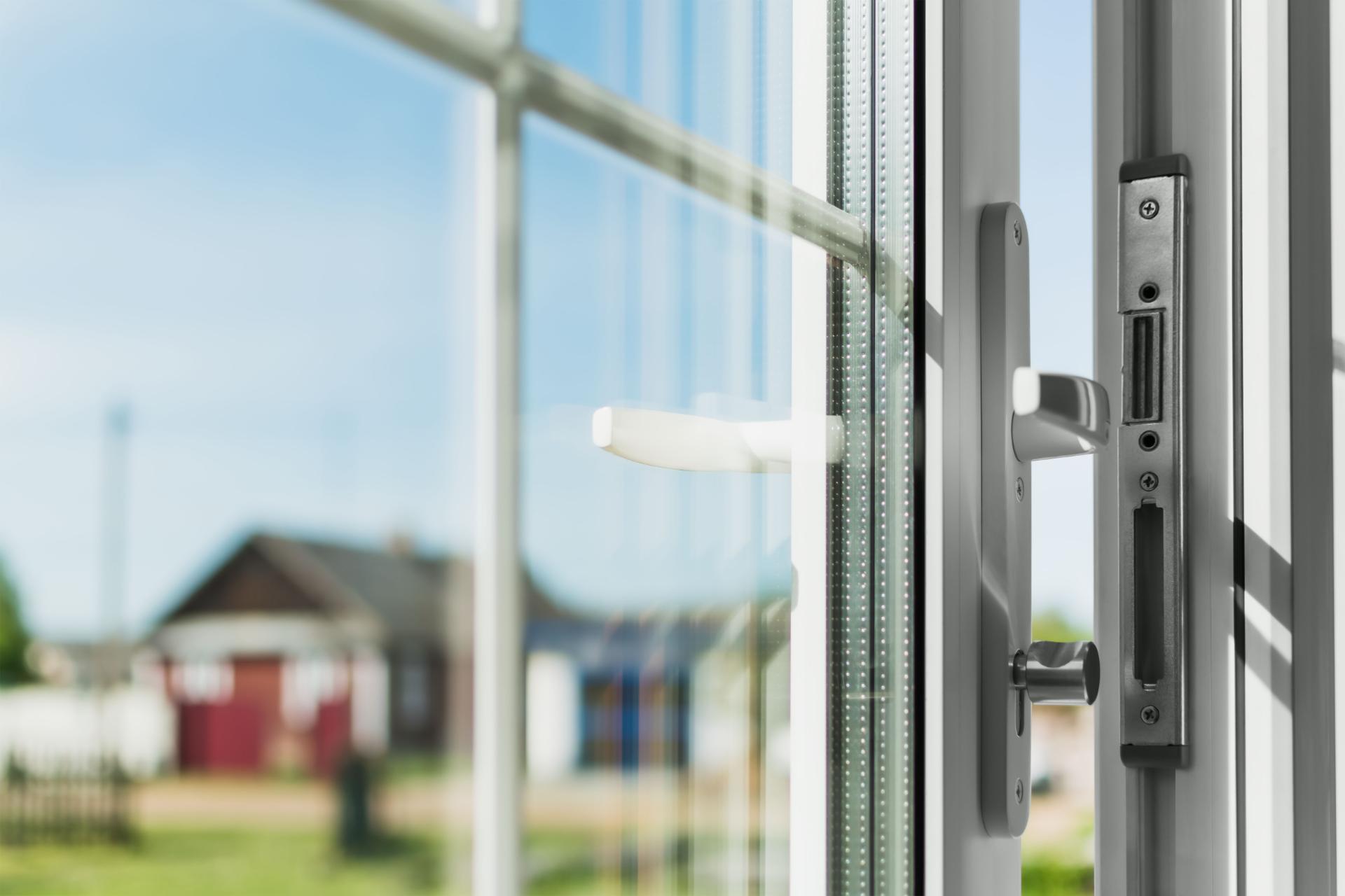 Person using screwdriver on window